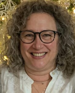 Jennifer Hagen evaluating logo design for printing and embroidery production