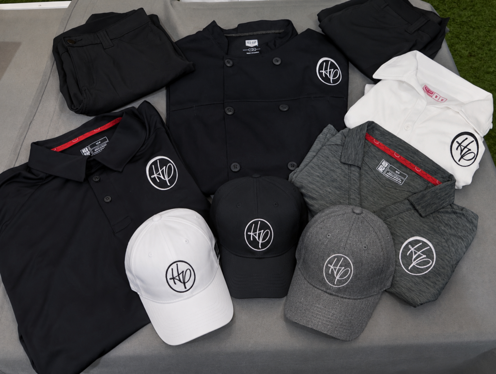 Role-specific uniforms for Howell Pointe Swim Club including embroidered polos, chef coats, performance apparel, and branded caps designed for hospitality, culinary, and management staff.